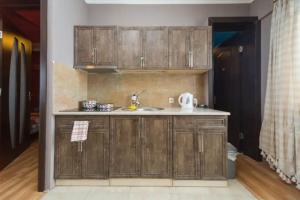 Η κουζίνα ή μικρή κουζίνα στο Good-Auri Apartment +6 φωτογραφίες
