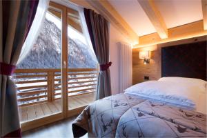 Postel nebo postele na pokoji v ubytování Chalet Marcora