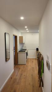 a kitchen and a living room with a table and chairs at Reload Apartments - FeWo3 im Remmeker Feld in Bad Arolsen +7 photos