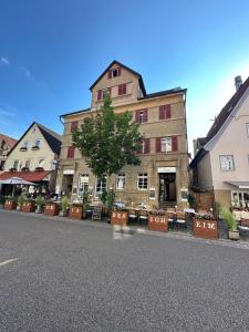a large building on the side of a street at Sali Homes Übernachten im Kulturdenkmal - Weinort in Besigheim