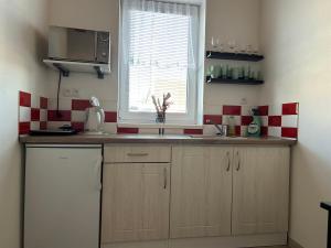 Kuchyň nebo kuchyňský kout v ubytování Apartmány Levandule
