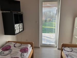 Postel nebo postele na pokoji v ubytování Apartmány Levandule