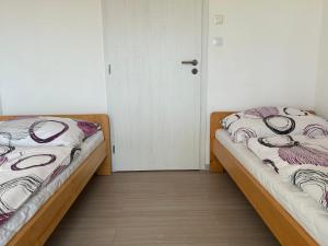 Postel nebo postele na pokoji v ubytování Apartmány Levandule