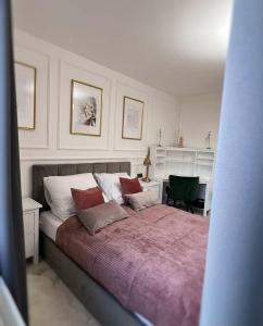 Ένα ή περισσότερα κρεβάτια σε δωμάτιο στο Apartament Lumière