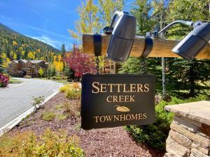 a sign for aeterns creek townhomes at Settlers Creek 6538 by SummitCove Lodging in Keystone