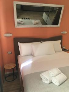 A bed or beds in a room at Mole Adriana Guest House