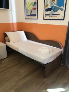 A bed or beds in a room at Mole Adriana Guest House