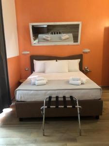 A bed or beds in a room at Mole Adriana Guest House