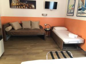 A bed or beds in a room at Mole Adriana Guest House
