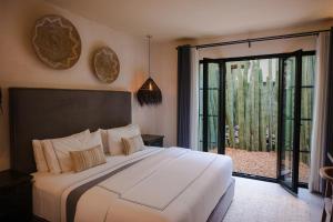 Voodi või voodid majutusasutuse Hotel Amatte San Miguel de Allende toas