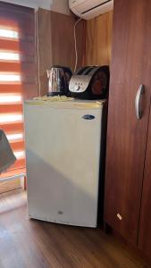 Kuchyň nebo kuchyňský kout v ubytování Small Apartment