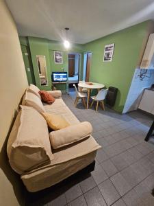 a bedroom with a bed and a table in a room at En la cañada cerca de todo in Córdoba