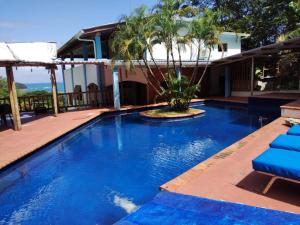 a swimming pool with blue water in a resort at VISTA CARIBE in Portobelo