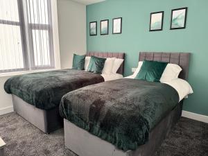 Ένα ή περισσότερα κρεβάτια σε δωμάτιο στο Newport En-suite Rooms Middlesbrough Centre