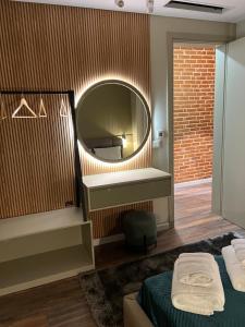 a bedroom with a mirror and a bed and a bed sidx sidx sidx at Liams Cozy Villa in Korçë +45 photos