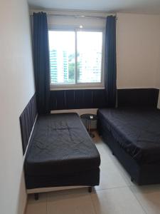 Postel nebo postele na pokoji v ubytování Flat novo, moderno e com vista sensacional + 37 fotografií