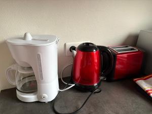 a counter with a coffee maker and a toaster at Appart 3P 57 m2 Le Coeur de la Krutenau Strasbourg in Strasbourg