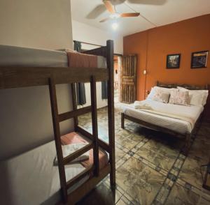 a bedroom with two bunk beds and a bed at Trem de Pouso Rustic Guest House in Tiradentes +35 photos
