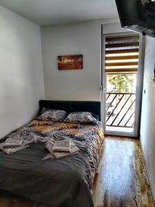 Postel nebo postele na pokoji v ubytování Vila Rosa, apartman 2
