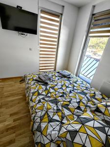 Postel nebo postele na pokoji v ubytování Vila Rosa, apartman 3