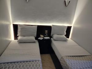 Letto o letti in una camera di Abo Elwafa Hotel