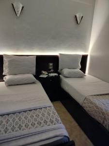 Letto o letti in una camera di Abo Elwafa Hotel