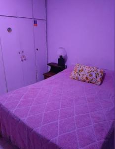 En eller flere senge i et værelse på Aguaribay