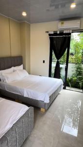 Ένα ή περισσότερα κρεβάτια σε δωμάτιο στο Entrebosques Luxury Casa Quinta
