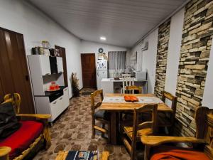 a kitchen and dining room with a table and chairs at Almar in La Paloma
