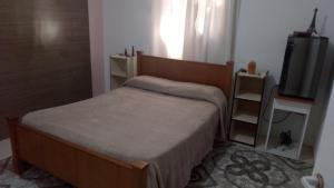 Ένα ή περισσότερα κρεβάτια σε δωμάτιο στο Casa con pileta San Luis Juana Koslay