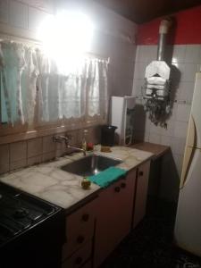 a kitchen with a sink and a counter top at Casa en Mar de Cobo in Mar de Cobo