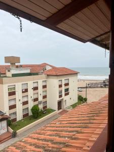 a view of a building and the beach at Torrejon 301 in Villa Gesell