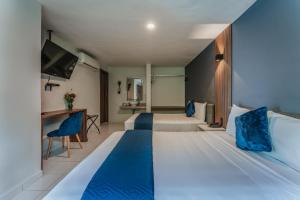 Postel nebo postele na pokoji v ubytování Hotel Casa Nova, Merida