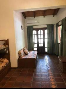 a room with a bed in a room with a window at Casa Quinta para Descansar en Mercedes in Mercedes