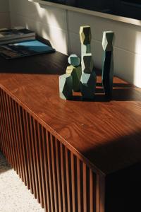 a wooden table with two vases on top of it at The Owl's Nest - Lakeside peacefulness ski & hiking in Austin +39 photos
