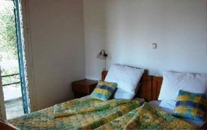 Postel nebo postele na pokoji v ubytování Olympia Paxos Villas & Apartments