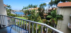 a balcony of a condo with a view of a harbor at Bayview Waters Apartments in Gold Coast