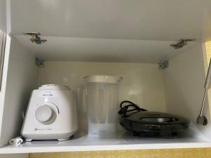 Küche/Küchenzeile in der Unterkunft Apt centro com garagem wifi próximo a congressos