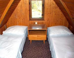 Posteľ alebo postele v izbe v ubytovaní Bungalovy Tatranec