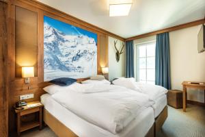 Posteľ alebo postele v izbe v ubytovaní Hotel Eden Rock