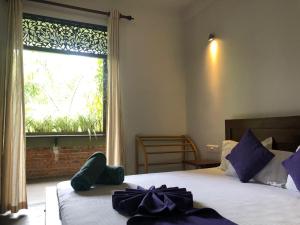 Postel nebo postele na pokoji v ubytování Sithagi Villa Unawatuna