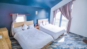 Katil atau katil-katil dalam bilik di Villa Hotel Rung Thong Da Lat