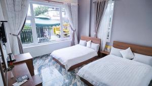 Katil atau katil-katil dalam bilik di Villa Hotel Rung Thong Da Lat
