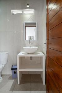 a bathroom with a sink and a toilet at kenanga Villa Ubud in Ubud