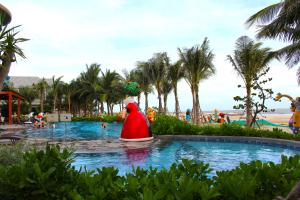 a santa claus in a pool at a resort at Kacy Homestay, Wonderland Hồ Tràm miễn phí vé MUSEUM in Xuyên Mộc