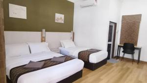 Krevet ili kreveti u jedinici u okviru objekta The Nutshell Chalet Langkawi