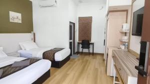 TV i/ili multimedijalni sistem u objektu The Nutshell Chalet Langkawi