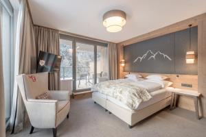 Кровать или кровати в номере Hotel Gurglhof Superior +37 фотографий