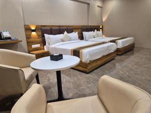 Postel nebo postele na pokoji v ubytování Hotel Grace Galaxy