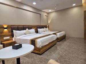Postel nebo postele na pokoji v ubytování Hotel Grace Galaxy